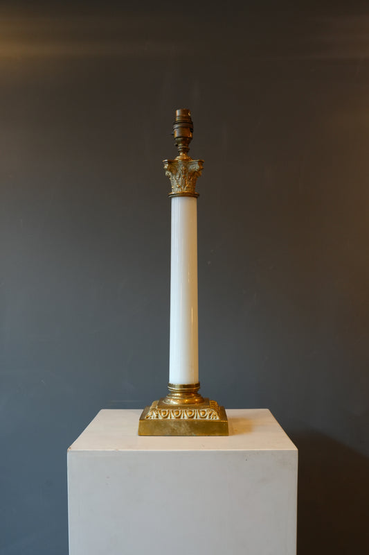 A large brass & opaline glass Corinthian column lamp.