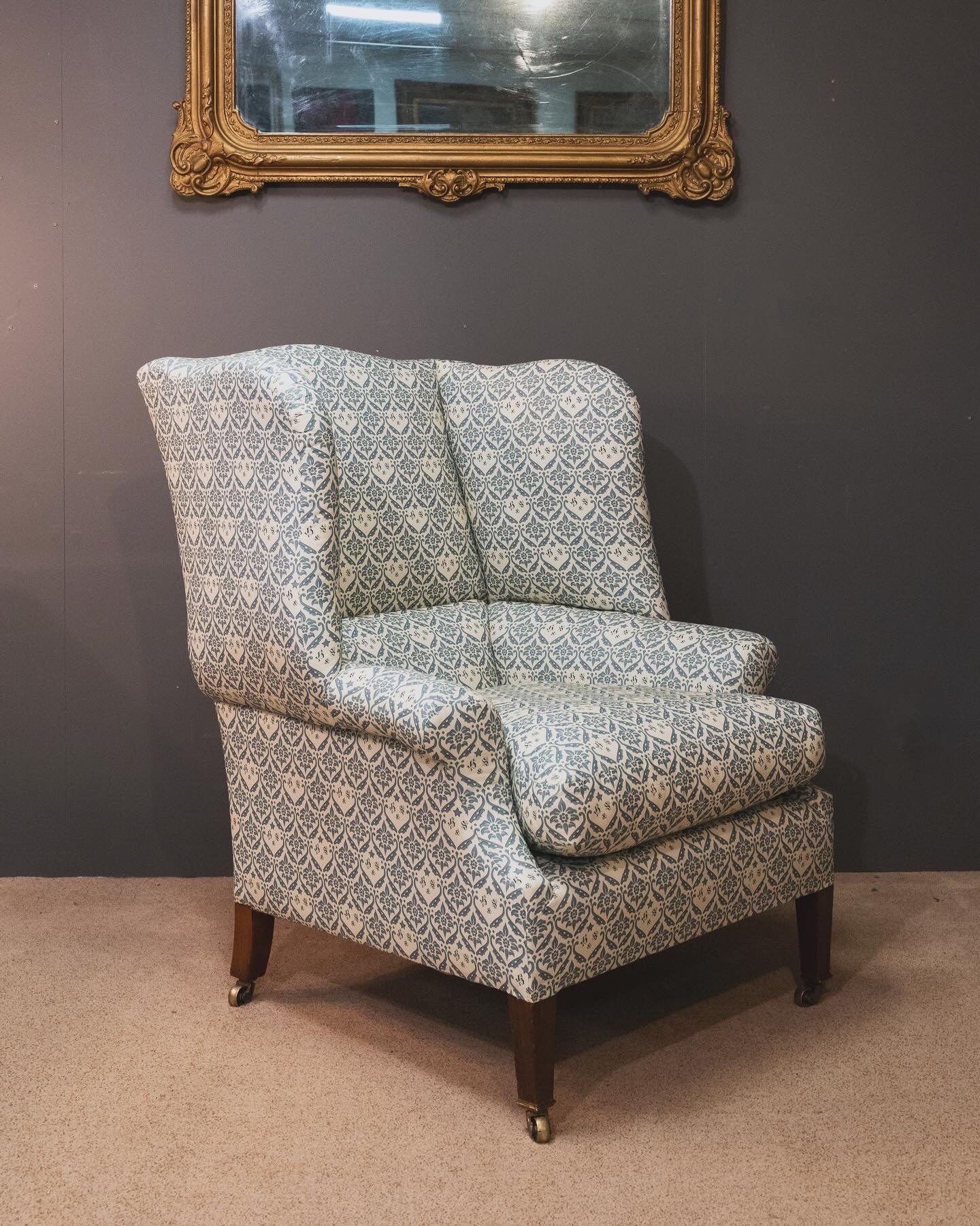 A Howard & Sons Wingback Armchair