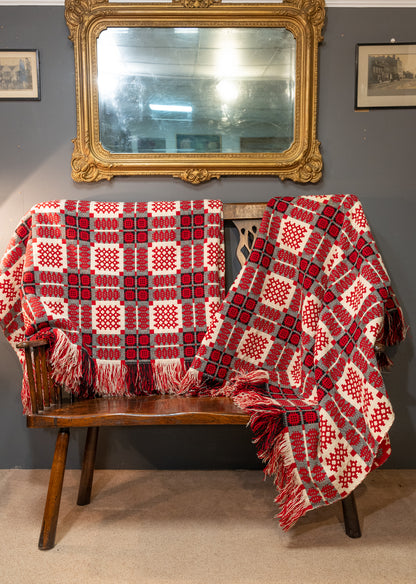 A pair of double sided traditional Welsh blankets