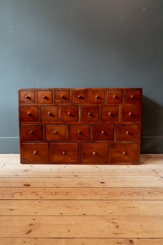 Bank of apothecary style drawers